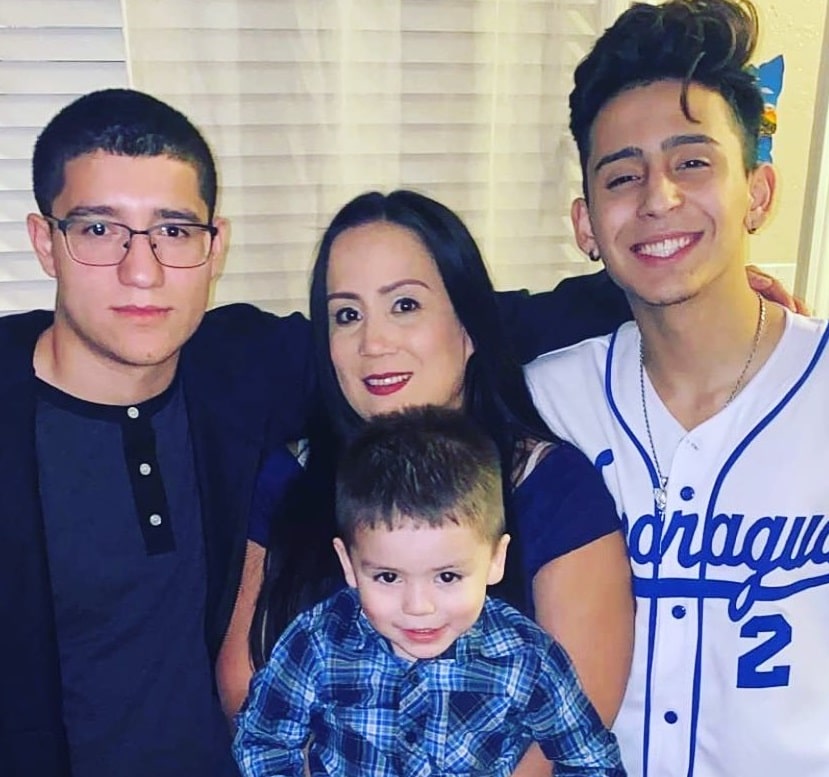 Alex Guzman with his Mother and Brothers 