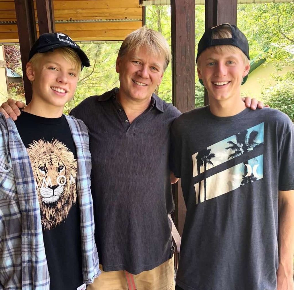 Carson Lueders with his father and brother